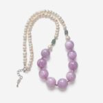 Luxury kunzite pearl necklace featuring prominent 13mm round lavender purple kunzite beads seamlessly transitioned into a strand of white freshwater pearls.