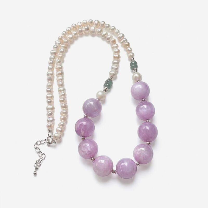 Luxury kunzite pearl necklace featuring prominent 13mm round lavender purple kunzite beads seamlessly transitioned into a strand of white freshwater pearls.
