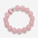 Authentic natural pink crystal bracelet by Dewery featuring 12mm translucent rose quartz beads, a chatoyant cat eye stone, and a silver-toned pearl on a clean white background.