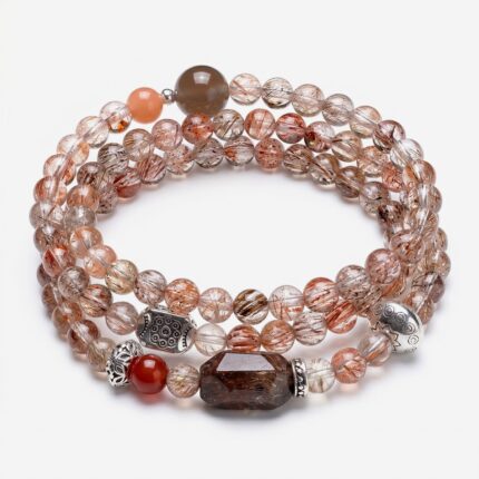 Multi-layer crystal wrap bracelet featuring 4-5mm natural rutilated quartz beads blended with a red agate accent and a shimmering grey moonstone.