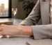 Minimalist crystal jewelry bracelet styled with a professional wardrobe from desk to dinner