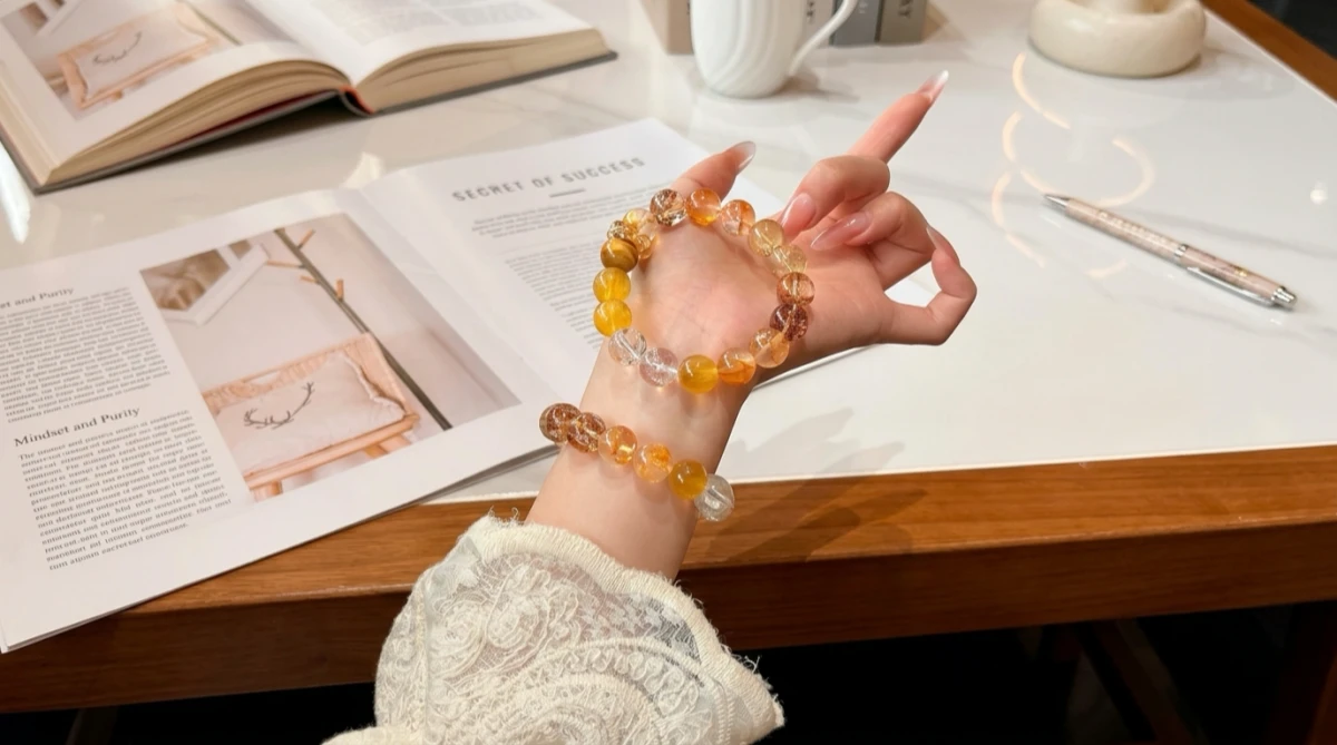 wearing citrine crystal bracelet on left wrist for money energy